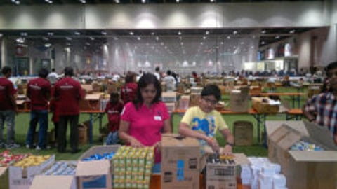 Thousands gather to provide labourers with care packages