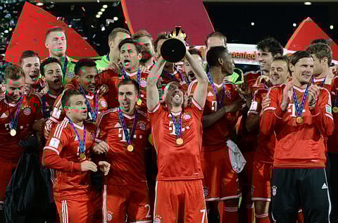 Bayern Munich's Franck Ribery holds the trophy aloft following the 2-0 win over Raja Casablanca in the Club World Cup final.