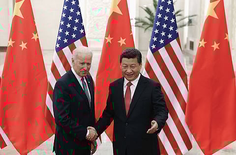 File picture: Chinese President Xi Jinping (R) shakes hands with then-U.S. Vice President Joe Biden (L).