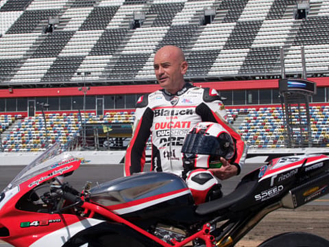 Italian driver Dario Marchetti challenges Saudi driver Bin Laden at Dubai Autodrome