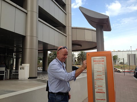 A resident uses an older parking metre in Dubai Media City. For illustrative purposes only.