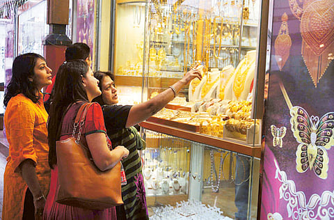 Shoppers look at the window displays at the Deira Gold Souq, Dubai.