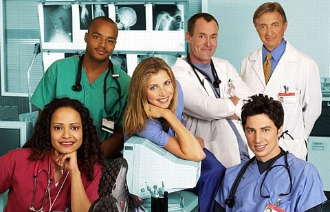 Zach Braff with his co-stars on Scrubs.