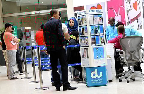 Executives from Du telecom attend customers at the Deira City Centre office. Telecom operator du has announced the appointment of Fahad Al Hassawi as acting CEO following the departure of Johan Dennelind.