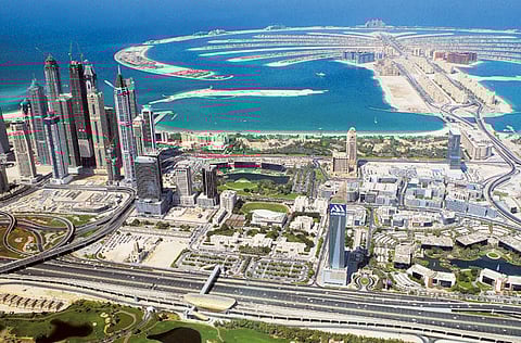 An aerial view of Dubai Marina and the Palm Jumeirah. Sentiment in the UAE real estatemarket is continuing to improve after a torrid period.