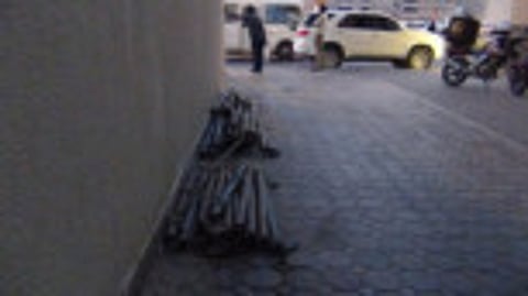 Iron pipes left on the sidewalk in Sharjah pose risk