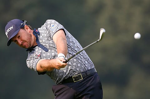 Graeme McDowell of Northern Ireland hits the ball at the ninth hole during the first round of the WGC-HSBC Champions golf tournament in Shanghai November 6, 2014.