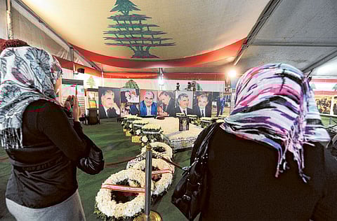 Lebanese women visit the grave of slain Lebanese Prime Minister Rafik Hariri during the ninth anniversary for his murder in downtown Beirut, Lebanon, 14 February 2014. Hariri and 22 other people were killed in the 14 February 2005 attack.