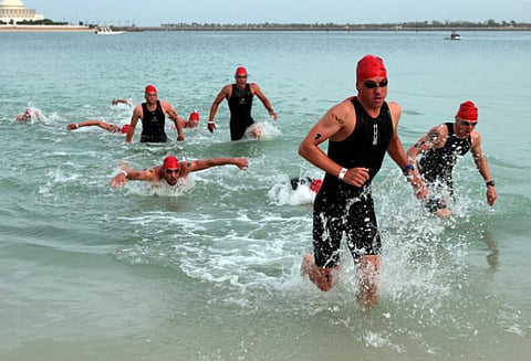 Athletes taking part in the Abu Dhabi International Triathlon, an annual feature of the UAE's sporting calender. The gruelling sport is expected to get a push in marketing with the induction of an experienced professional like Chris Kermode in the world body.