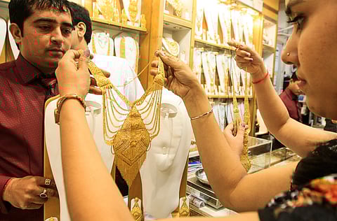 Exchange or cash out? Gold consumers in the UAE could get a lot out of their existing holdings. If they had bought in 2015, they could make a clean Dh40-Dh45 a gram now. File picture of activity at a Kanz Jewels outlet in Gold Souq.