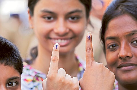Young voters show their inked fingers after voting in Bengal,Howrah, west of Kolkata (File)