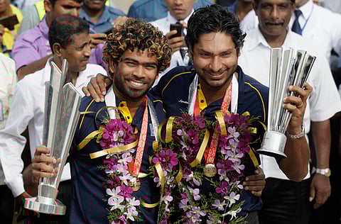 Sri Lanka's T20 cricket World Cup winning team's captain Lasith Malinga, left, and teammate Kumar Sangakkara