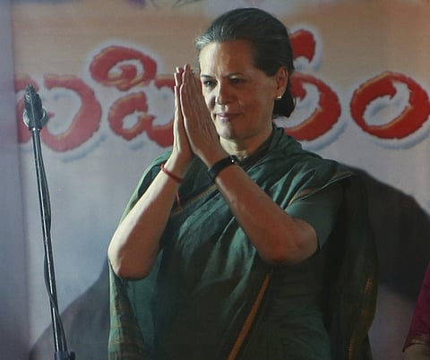 Indian ruling congress party president Sonia Gandhi greets during an elections rally in Medak district of Andhra Pradesh 100 kilometers away from Hyderabad, India, Sunday, April 27, 2014. (AP Photo/Mahesh Kumar A.)