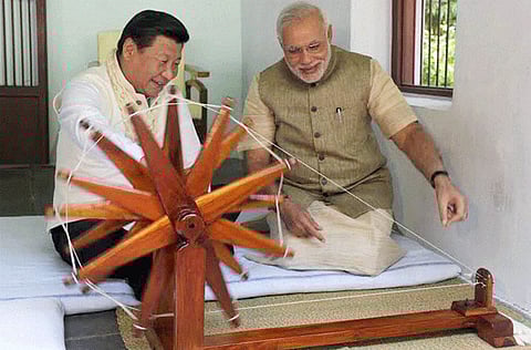 File photo: India's Prime Minister Narendra Modi with Chinese President Xi Jinping at Gandhi Ashram in Ahmedabad, India..