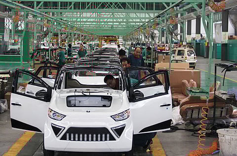 Workers assemble electric cars in a factory in Zouping, east China's Shandong province. Profits at China's industrial firms rose 179 per cent year-on-year in the first two months of 2021 to 1.114 trillion yuan ($170.31 billion).