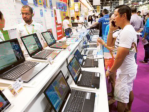 A 2018 file photo of visitors looking for deals on laptops in Dubai.