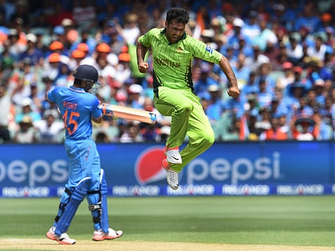 Pakistan bowler Sohail Khan (right), celebrates after dismissing India's Rohit Sharma during their 2015 World Cup match in Australia.