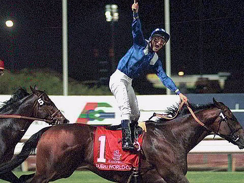 Jockey Richard Hills rides Almutawakel to victory in the world’s richest race, the five-million dollar Dubai World Cup in 1999