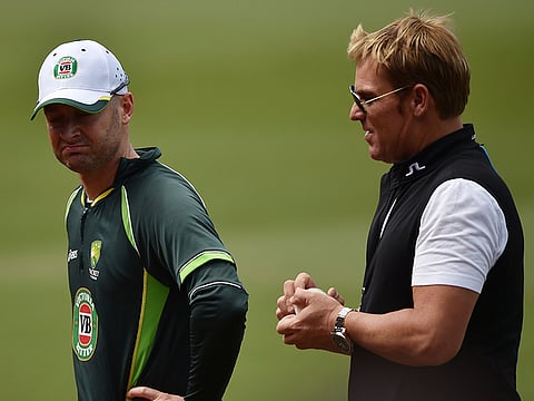 Michael Clarke (left) revealed that Shane Warne was not ready to take instructions from their hugely successful coach John Buchanan.