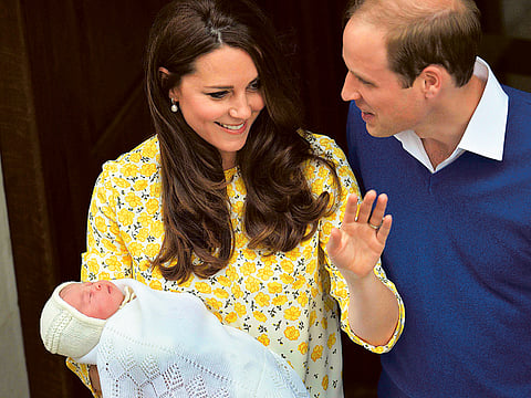 Britain’s Prince William and Kate with their baby daughter in
London.