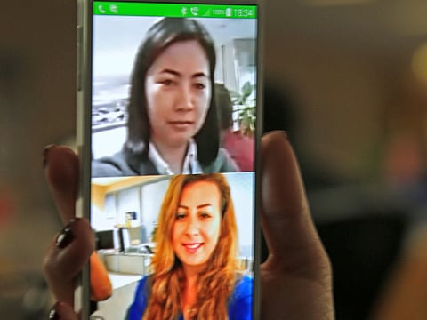 A face-to-face video call in progress. For illustrative purposes only.