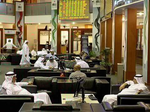 File photo: Traders at Dubai Financial Market at Dubai World Trade Centre.