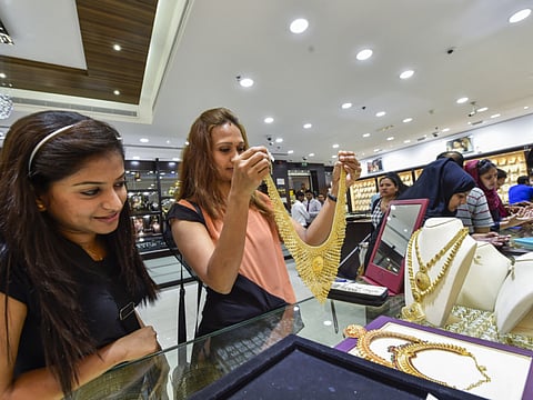 People buying gold jewellery at the Malabar Gold & Diamonds store.