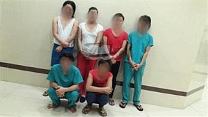 6 held during raids on massage facilities