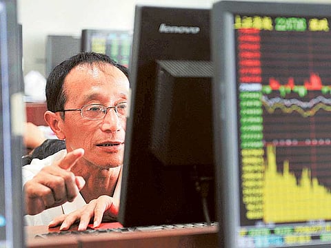 China's wealthiest would have felt a lot less rich after their billions got wiped off on the markets Monday. File picture of a brokerage house in Hangzhou.