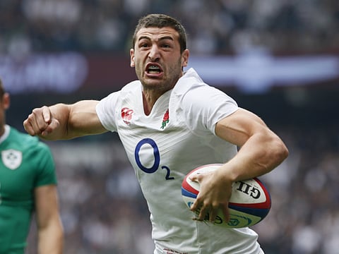 Jonny May celebrates for England.
