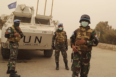 U.N peacekeepers of the United Nations Interim Force in Lebanon (UNIFIL) wear face masks while they monitor the Lebanese-Israeli border in south Lebanon