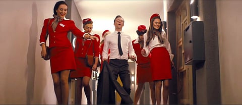 Tom Hiddleston dances through a retro hellscape in the trailer for ‘High-Rise’