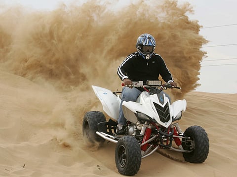 A rider on a quad bike in the desert in Dubai. Picture for illustrative purposes only.