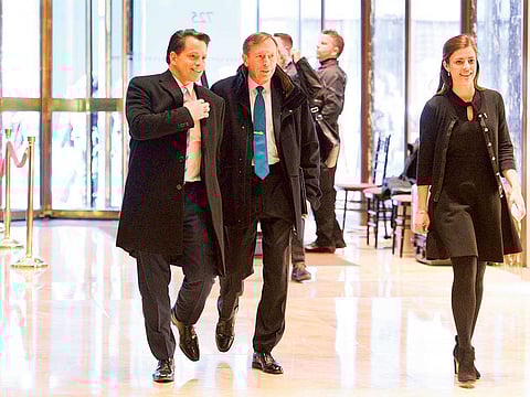 Anthony Scaramucci (left) walks with David Petraeus, former director of the CIA, at Trump Tower in New York.