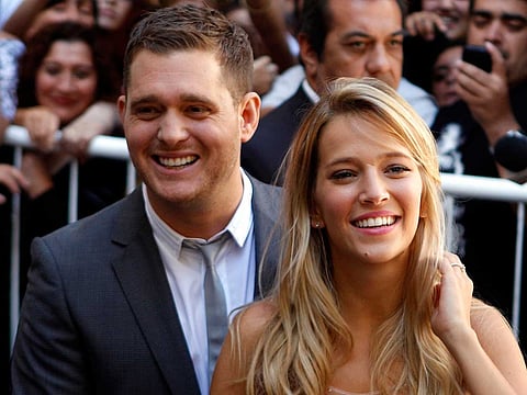 This March 31, 2011 file photo shows Canadian pop star Michael Buble and Argentine actress Luisana Lopilato in Buenos Aires, Argentina.