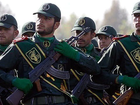 Iranian Revolutionary Guard members march during a parade ceremony.