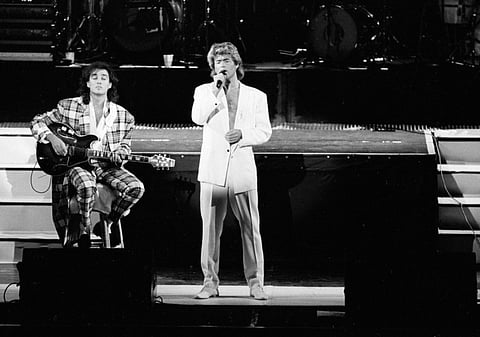 A 1985 file photo of the British pop duo Wham!, Andrew Ridgeley on guitar and George Michael on vocals.