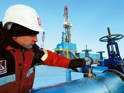 File photo: A worker at the Lukoil company owned Imilorskoye oil field in Kogalym, Russia.