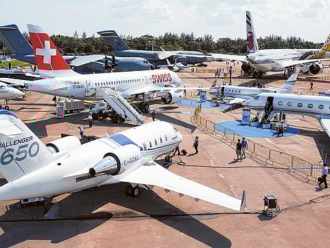 That grounded feeling - the global airline industry is cutting capacity and routes as it tries to combat the virus outbreak. File picture of business jets on display at the Singapore Airshow.