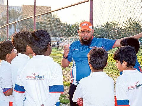 Pakistan’s legendary spinner Saqlain Mushtaq with budding cricketers of the Maxtalent academy during an earlier visit.