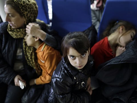 Migrant woman Maha, from the Yazidi community, sits with some of her children, on a MOAS, Migrant Offshore Aid Station, a Malta-based organization boat after they were rescued while trying to cross in a dinghy the Aegean Sea between the eastern Greek Island of Agathonisi and the nearby Turkish shores, as they are taken to Samos Island.