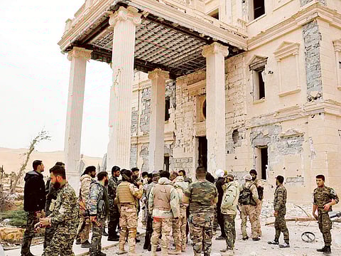 File picture: Syrian forces gather at a palace complex on the western edge of Palmyra.