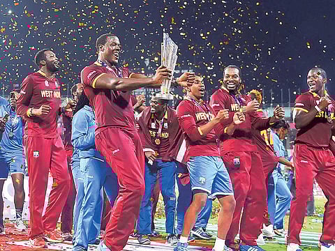 Members of the victorious West Indies team celebrate with the winners' trophy after winning the World T20 tournament in 2016.