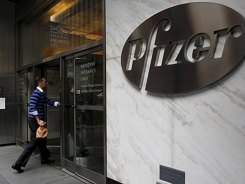 A man enters the employee entrance of the Pfizer World Headquarters building in the Manhattan borough of New York, U.S., November 23, 2015.