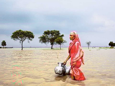 Rahima Khatun from Khanpur village in Bangladesh has to fetch drinking water from another village every day
