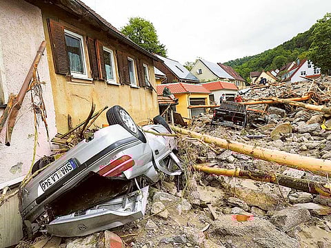 People look at the damage caused by the floods in Braunsbach, Germany.