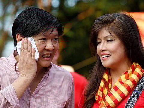 File photo: Former Senator Ferdinand "BongBong" Marcos Jr talks to his sister Senator Imee Marcos (right).