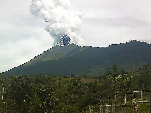 Kanlaon volcano spews ash into the air as seen from the observation post in La Carlota town. File photo taken in 2019.
