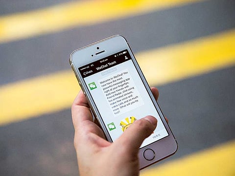 A message on WeChat said, "Unable to view this content because it violates regulations."