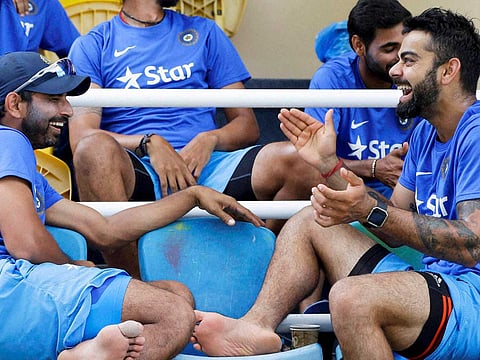 India’s captain Virat Kohli (right) with bowler Mohammed Shami